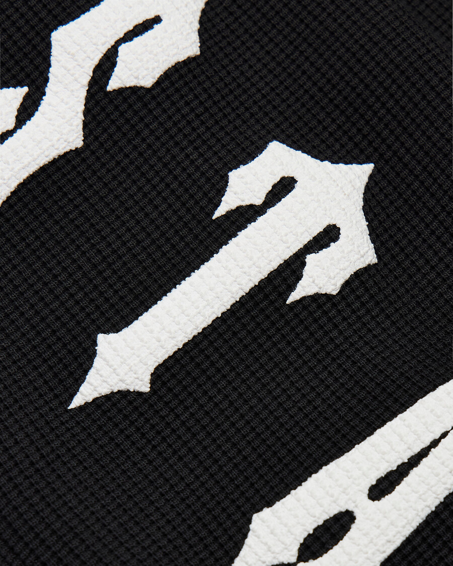 top de manga larga con diseño de gofre de trapstar x ed hardy - negro